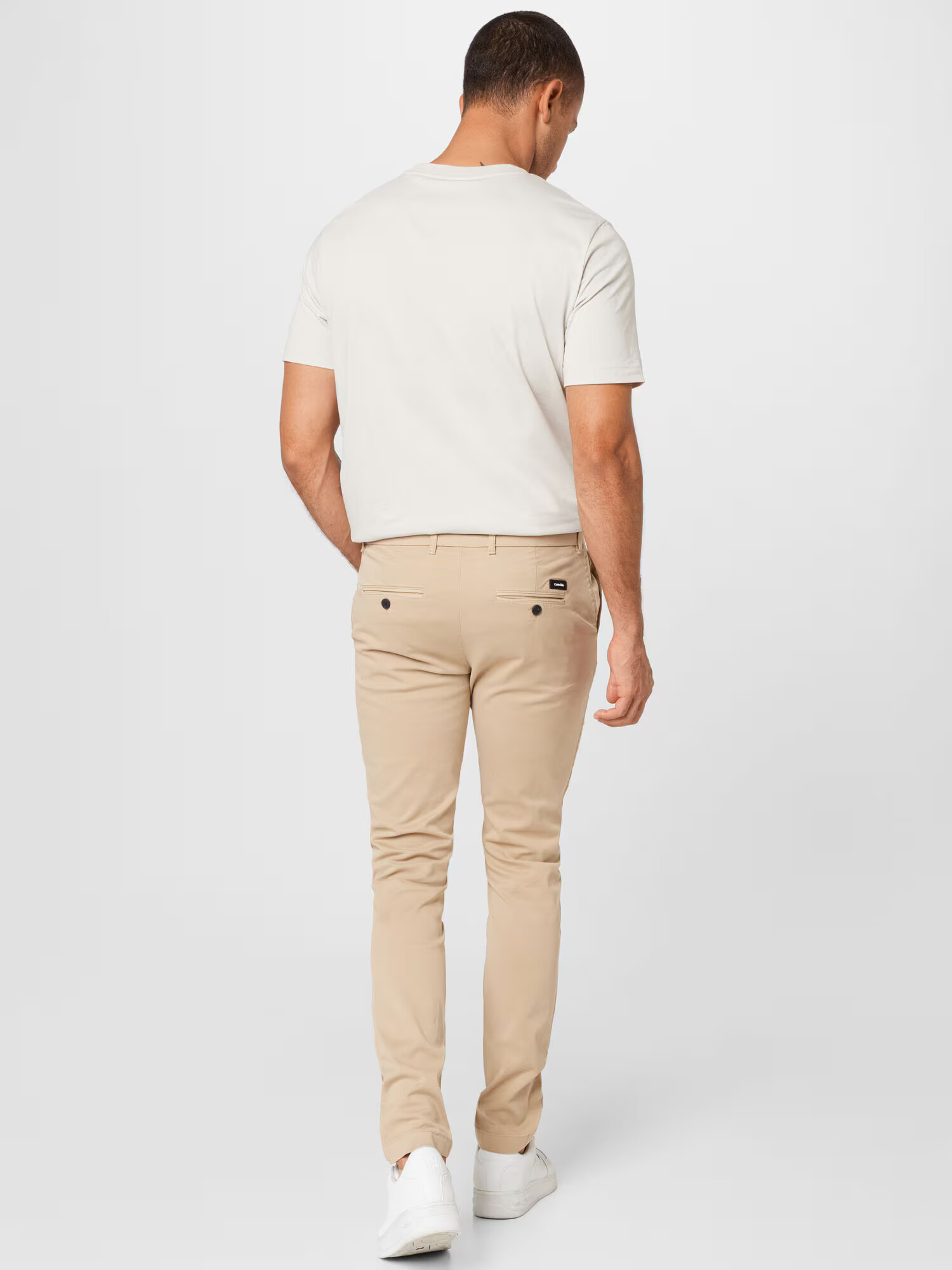 Calvin Klein Chino nohavice piesková - Pepit.sk