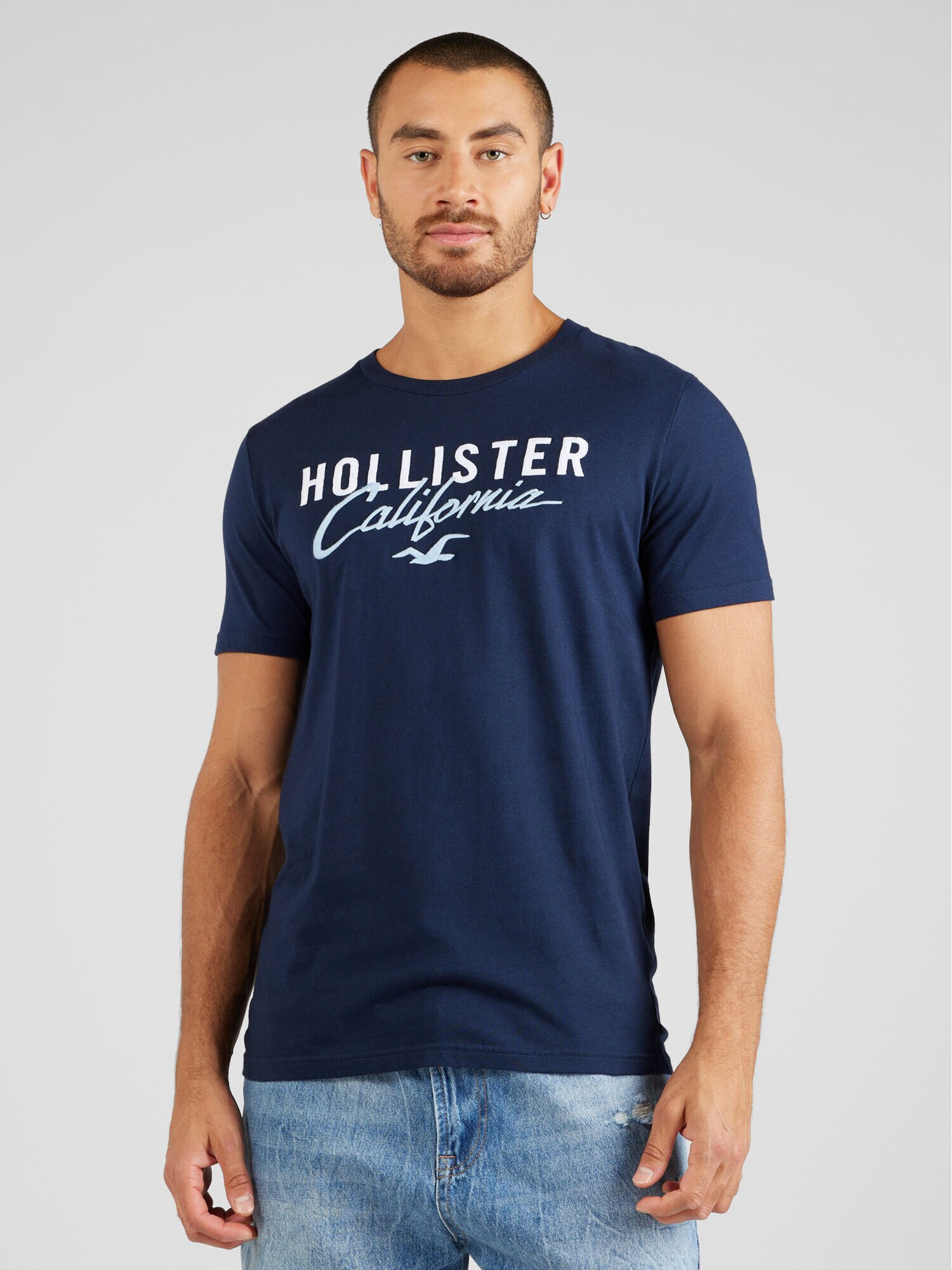 HOLLISTER Tričko modrá / hnedá / čierna / biela - Pepit.sk