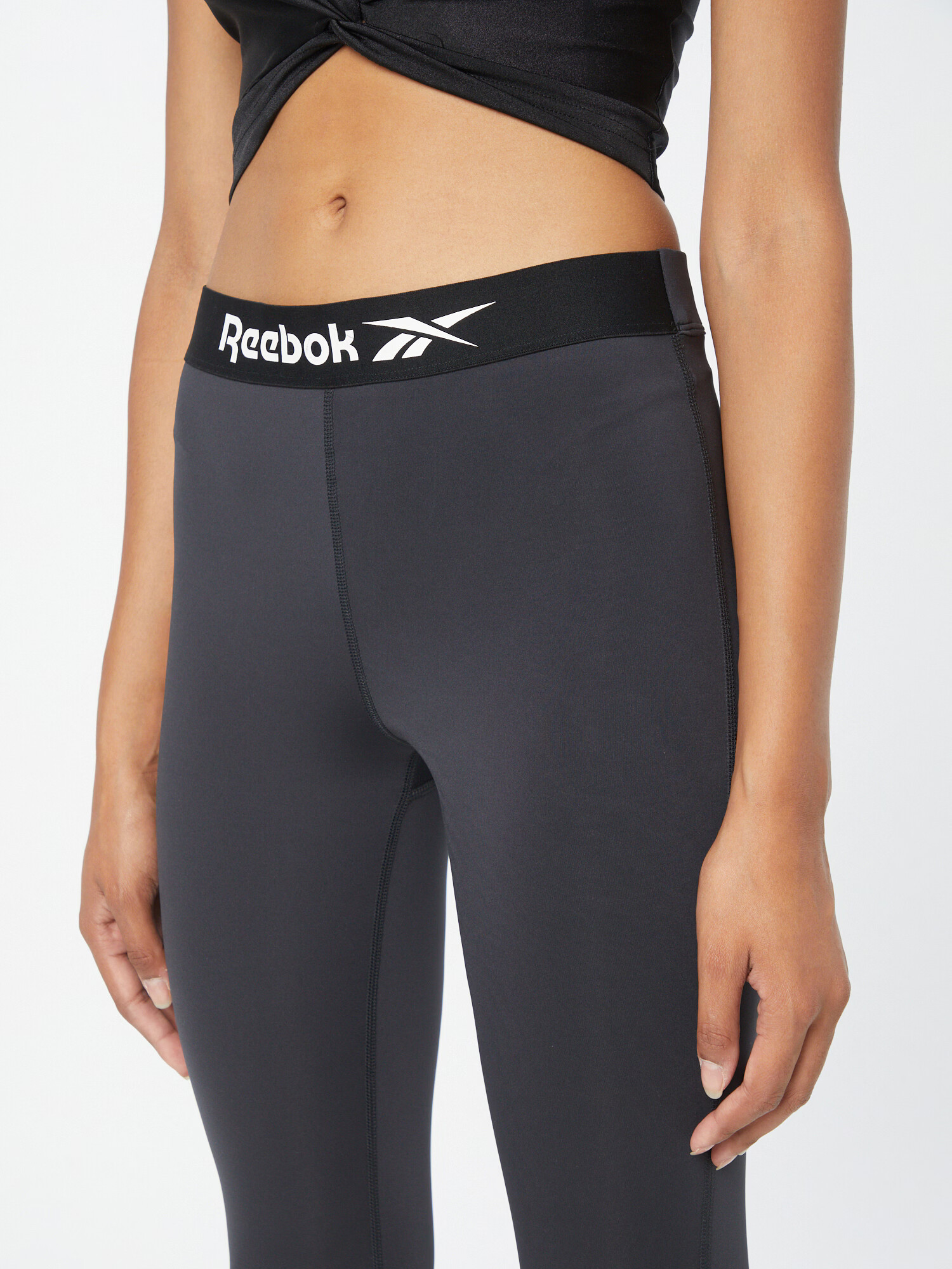 Reebok Sport Športové nohavice čierna / biela - Pepit.sk