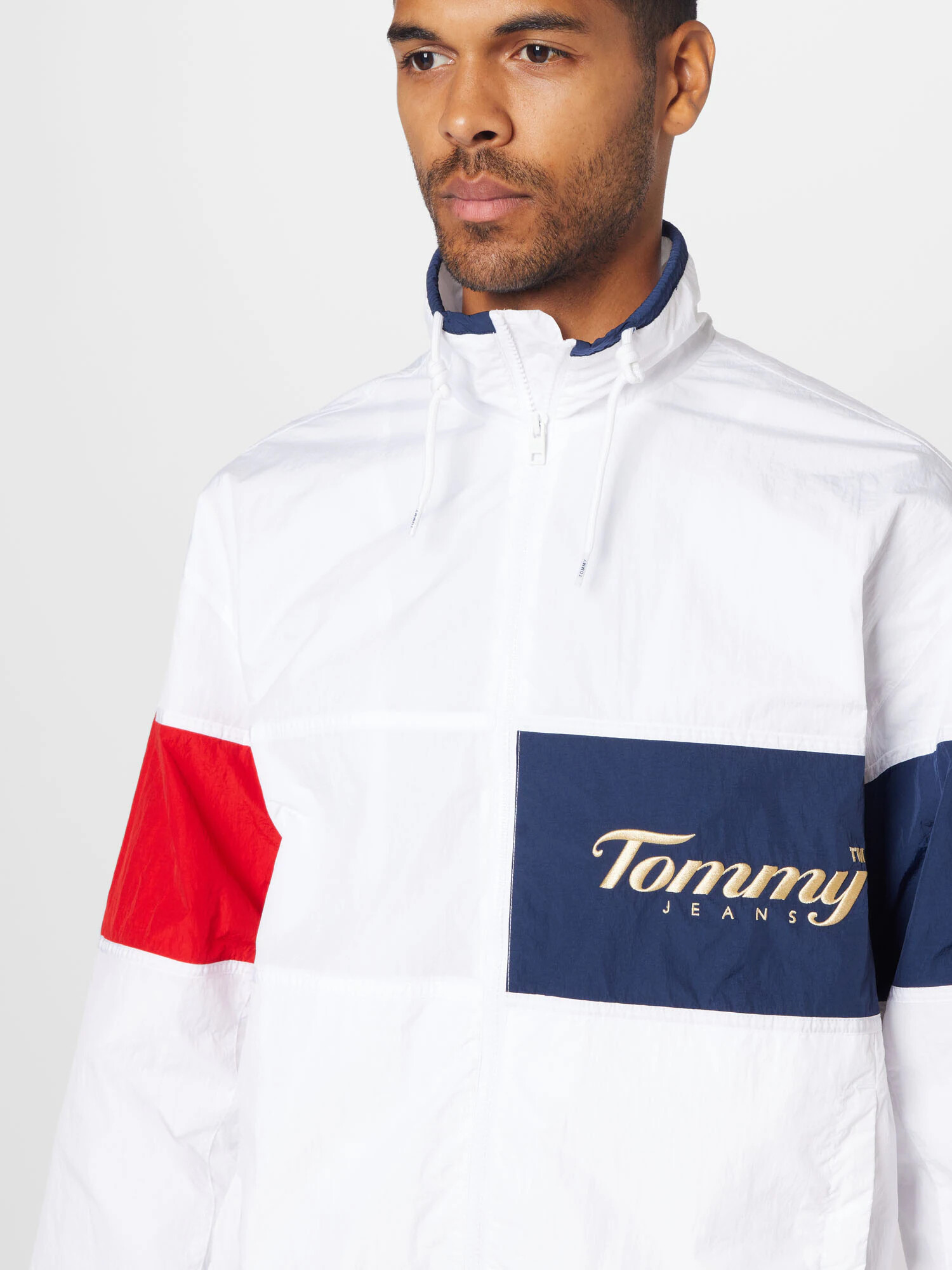 Tommy Jeans Prechodná bunda námornícka modrá / zlatá žltá / červená / biela - Pepit.sk