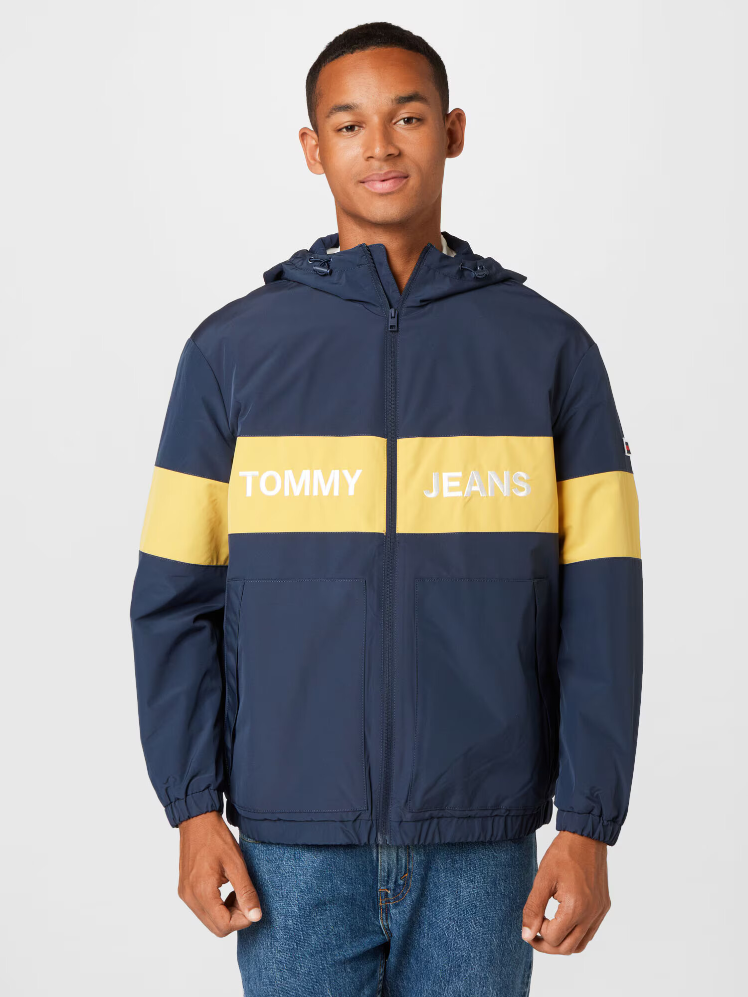 Tommy Jeans Prechodná bunda námornícka modrá / žltá / biela - Pepit.sk