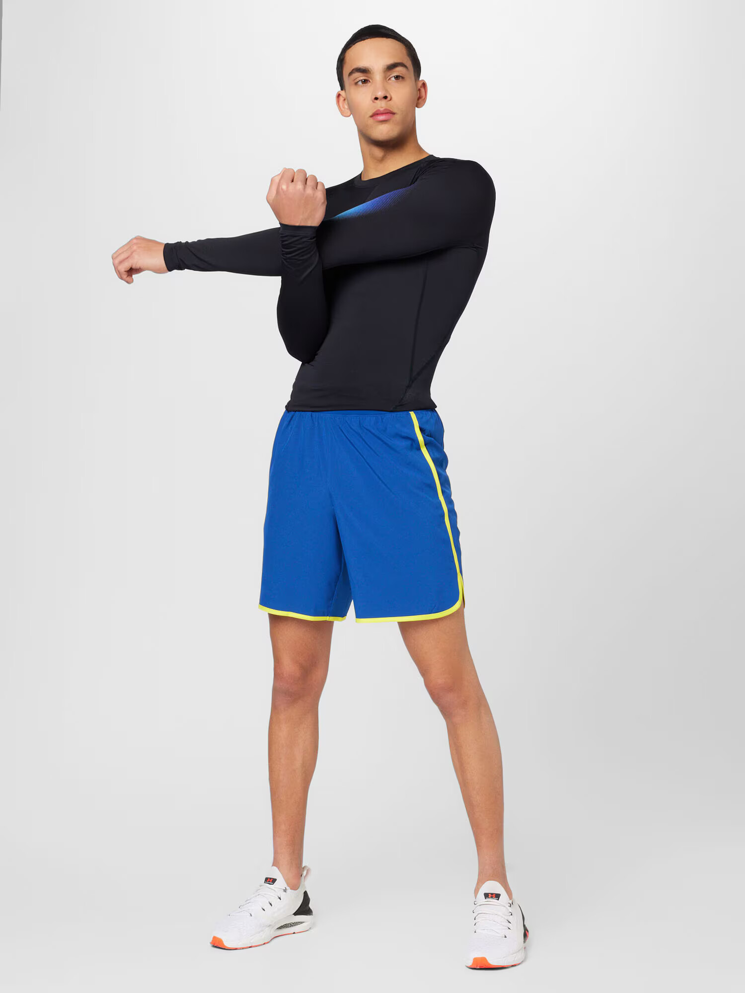 UNDER ARMOUR Športové nohavice 'HIIT' modrá / žltá - Pepit.sk