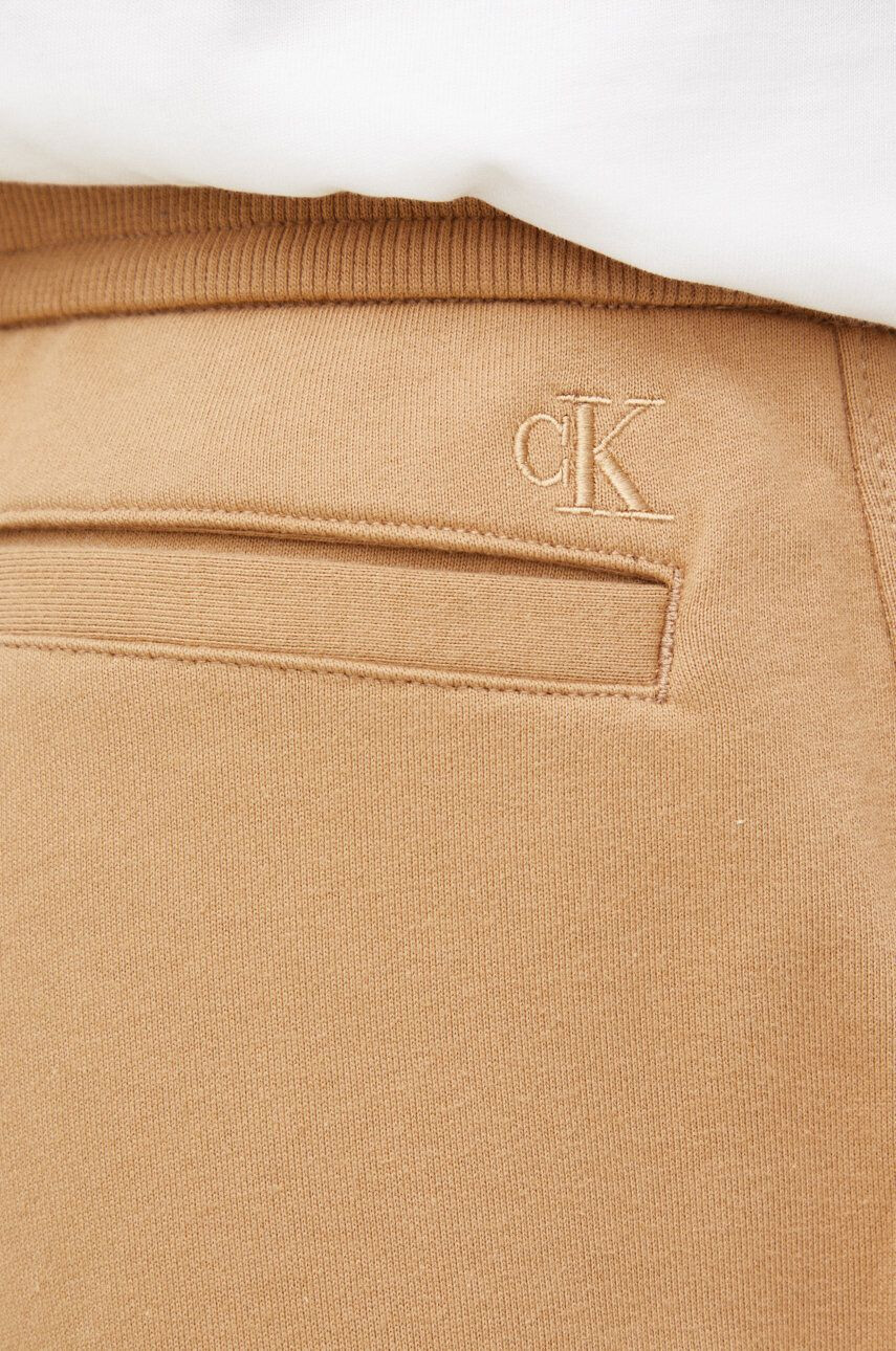 Calvin Klein Jeans Bavlnené tepláky pánske hnedá farba s potlačou - Pepit.sk