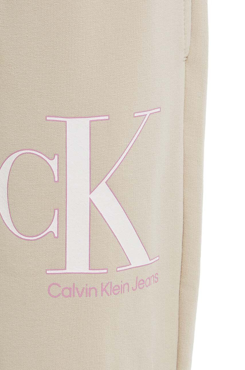 Calvin Klein Jeans Detské tepláky béžová farba vzorované - Pepit.sk