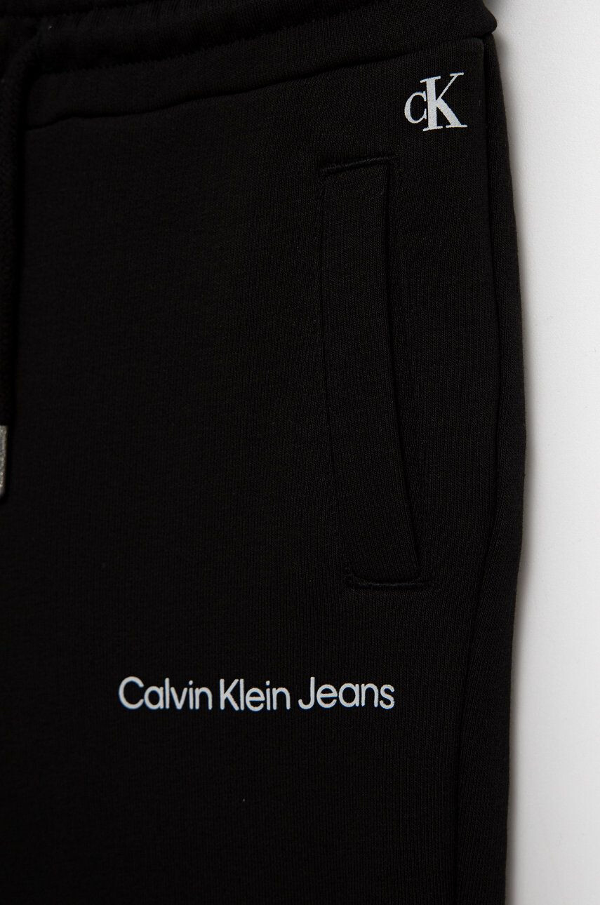 Calvin Klein Jeans Detské tepláky čierna farba jednofarebné - Pepit.sk