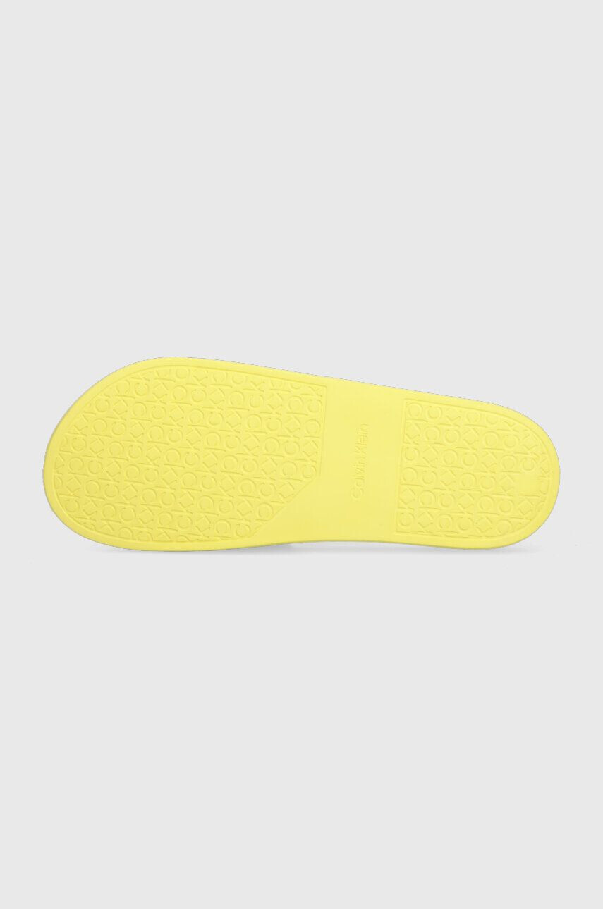 Calvin Klein Šľapky POOL SLIDE RUBBER pánske žltá farba HM0HM00455 - Pepit.sk