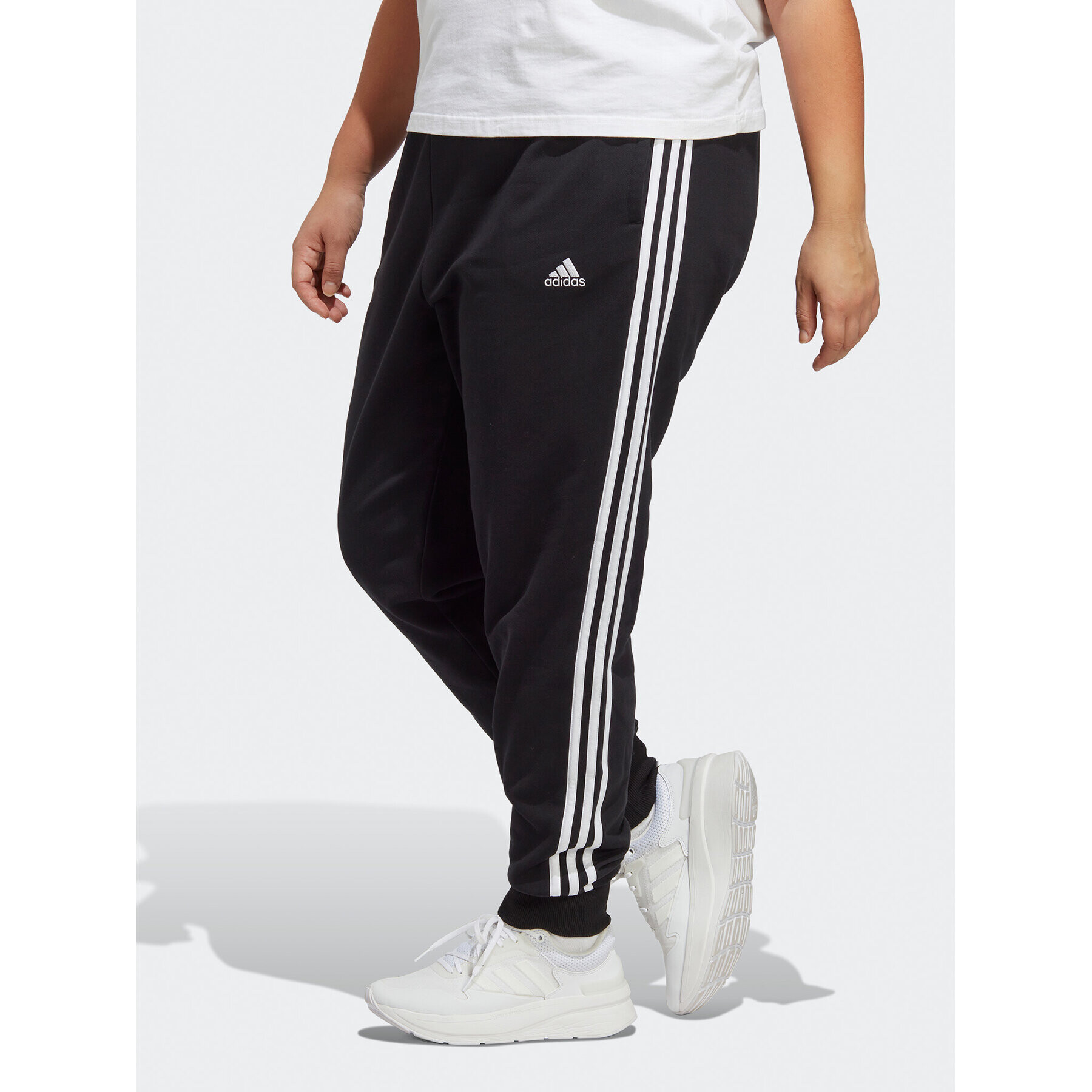 adidas Teplákové nohavice Essentials 3-Stripes French Terry Cuffed Joggers (Plus Size) IB8745 Čierna Slim Fit - Pepit.sk