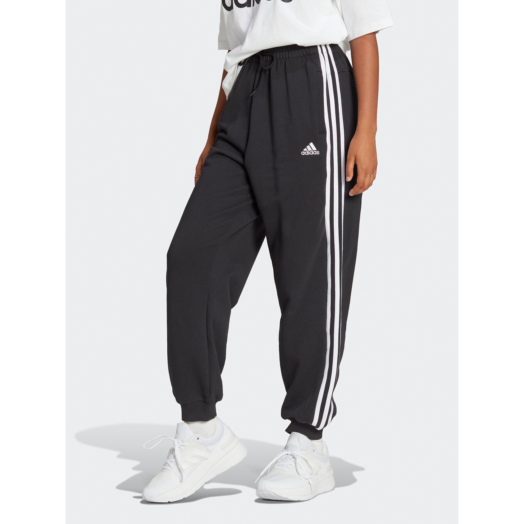 adidas Teplákové nohavice Essentials 3-Stripes French Terry Loose-Fit Joggers HA4375 Čierna Loose Fit - Pepit.sk