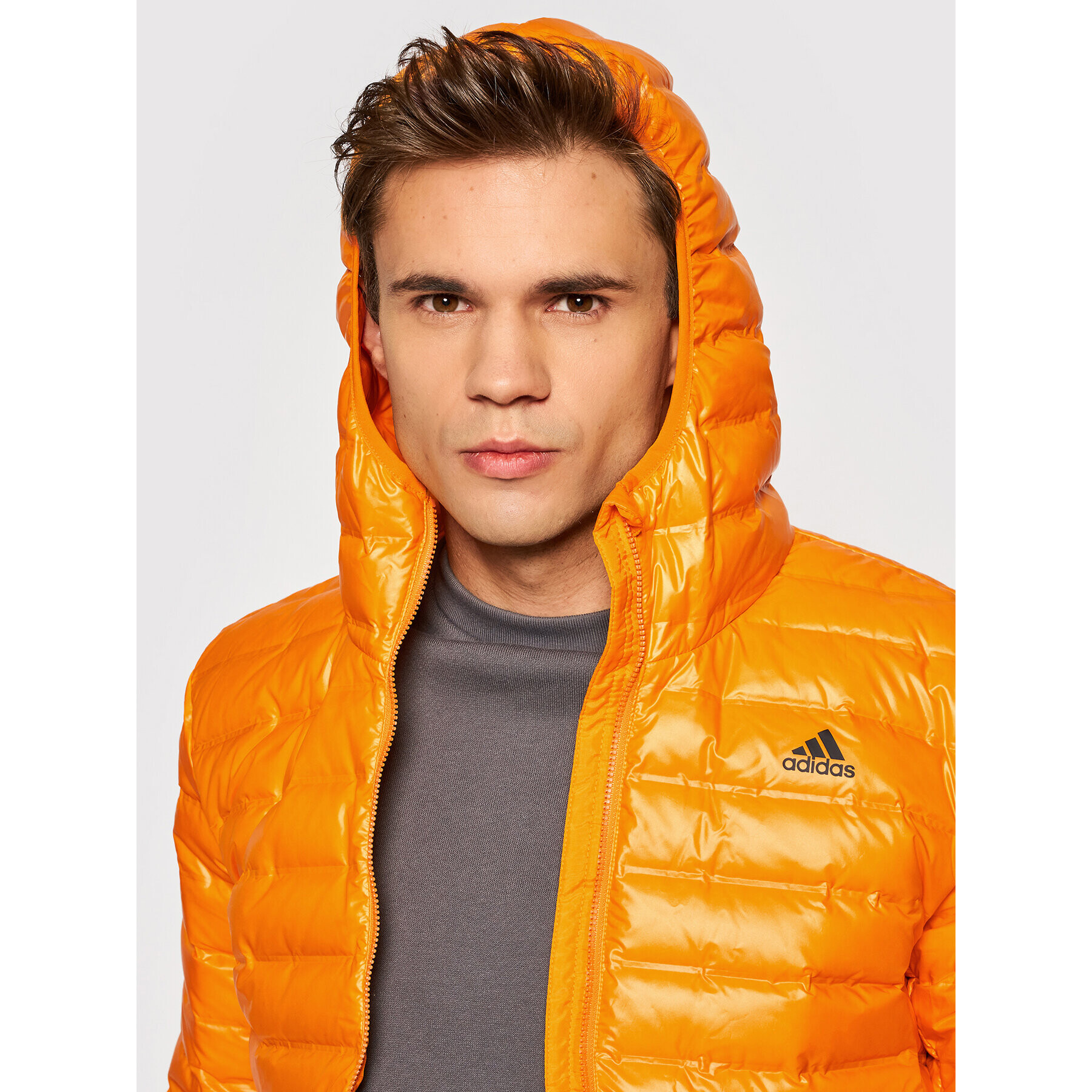 adidas Vatovaná bunda Varilite Hooded GT9215 Oranžová Slim Fit - Pepit.sk