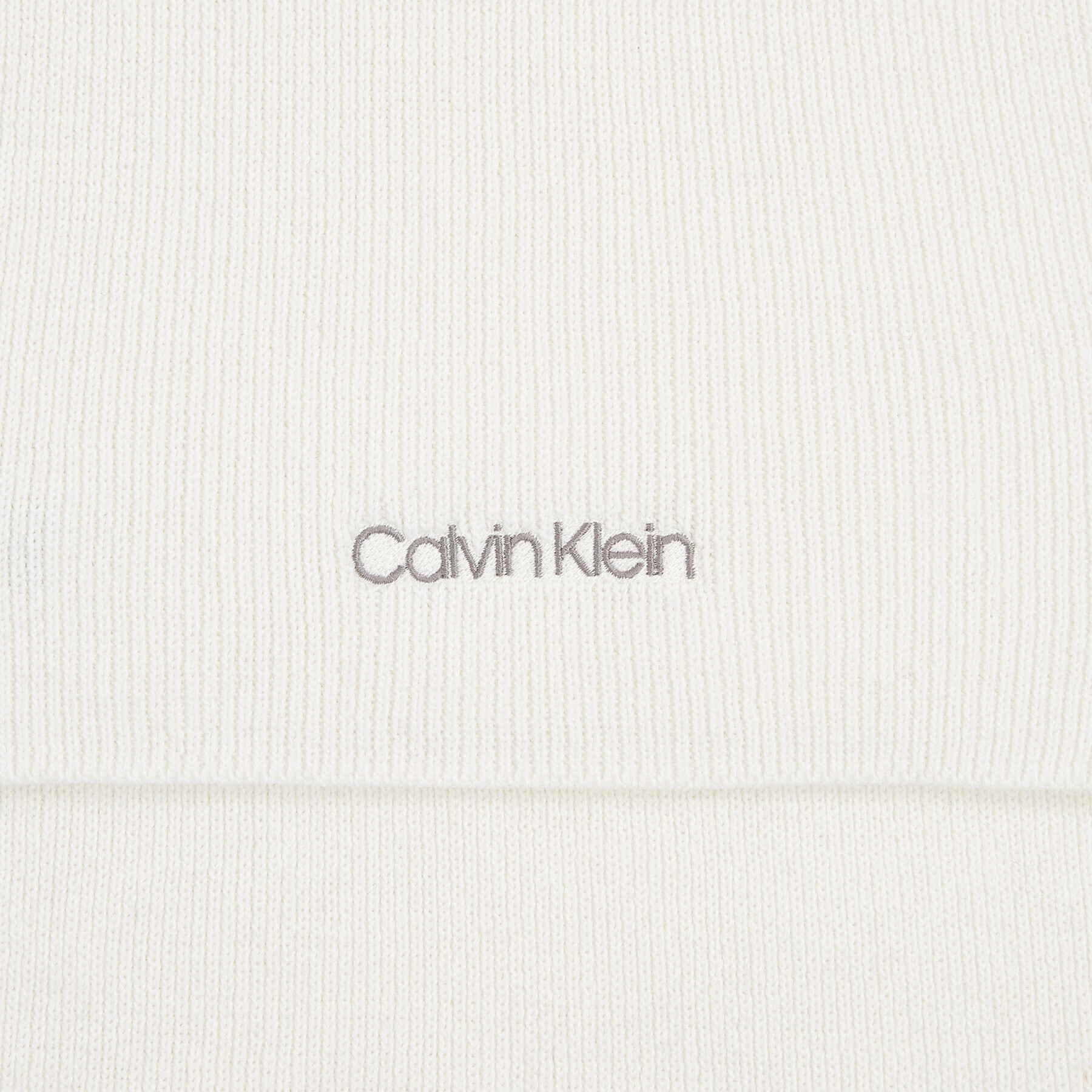 Calvin Klein Šál Essential Knit Scarf 30X180 K60K608485 Écru - Pepit.sk