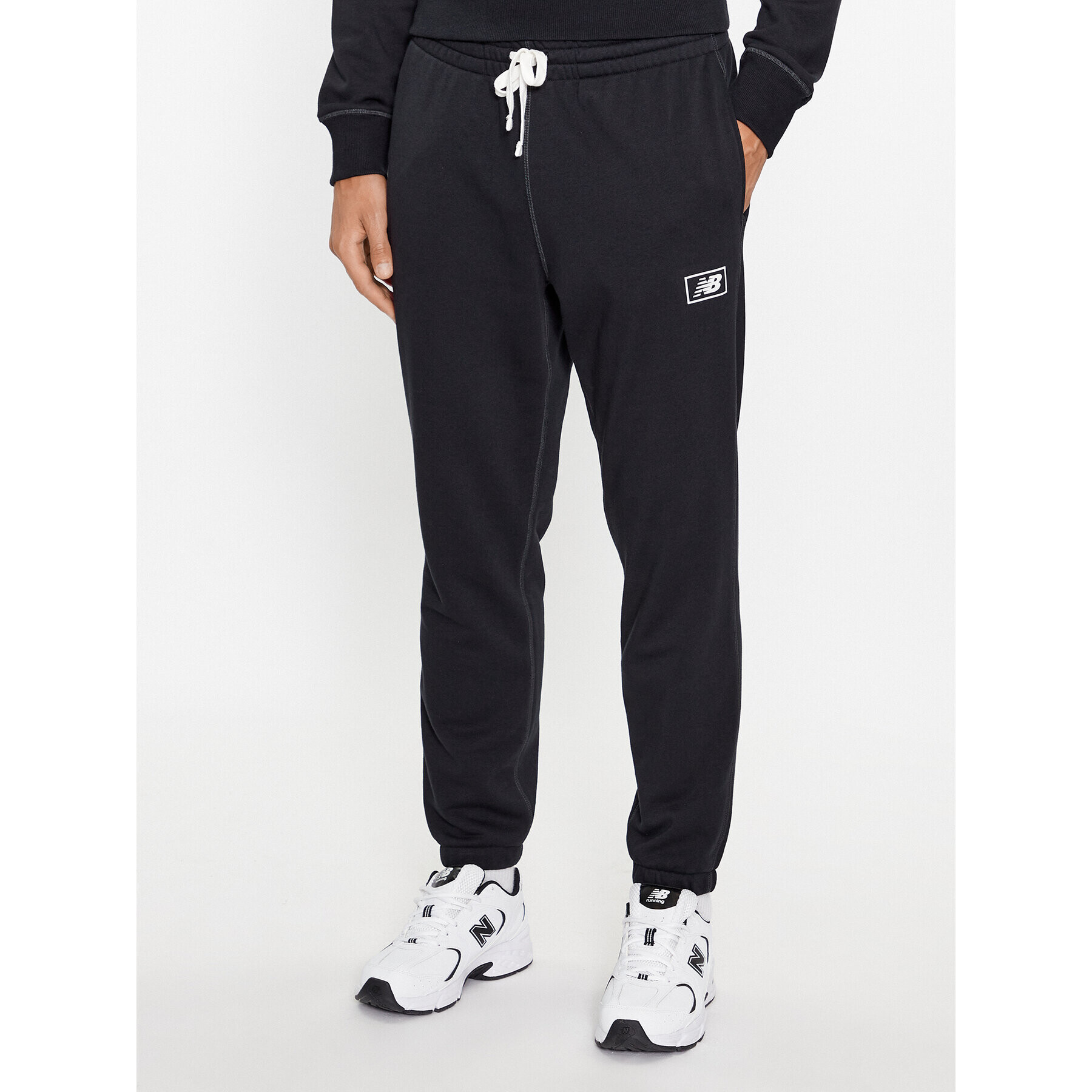 New Balance Teplákové nohavice NB Essentials Sweatpant MP33509 Čierna Regular Fit - Pepit.sk